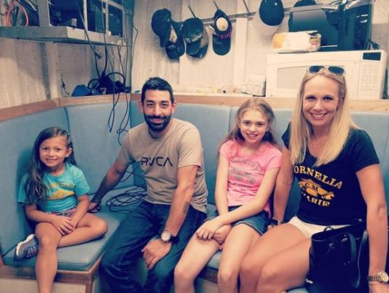 Josh Harris with his girlfriend, Jenna and his children